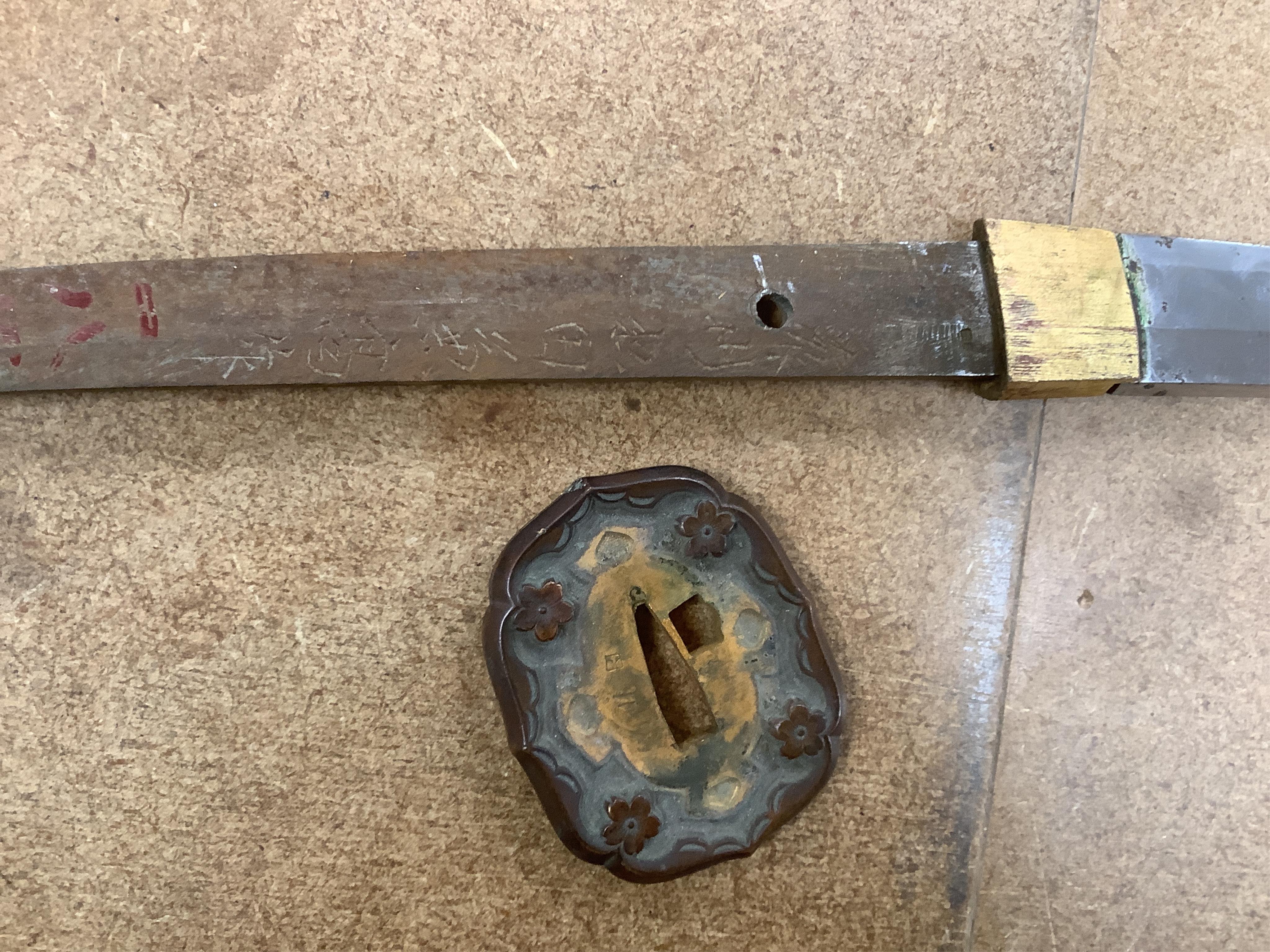 A Japanese WWII army officer’s sword Katana, blade 65cm, signed tang, retaining good polish, in shin gunto mounts. Condition - good